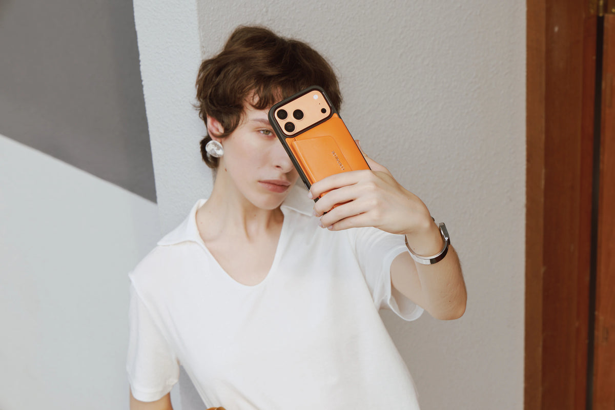 Orange CORTAILOR MagSafe leather wallet stand and matching iPhone case