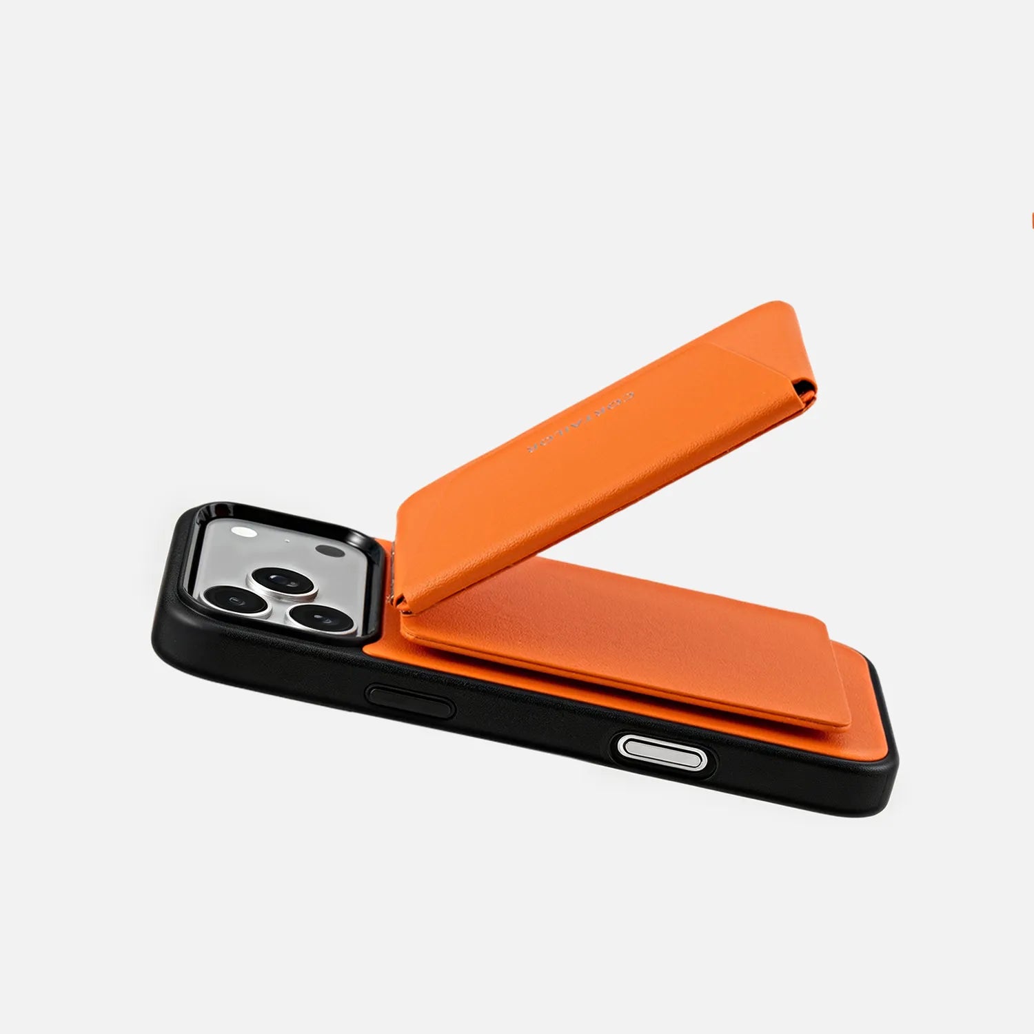 Orange CORTAILOR MagSafe Leather Wallet Stand magnetically attached to a MagSafe-compatible iPhone case