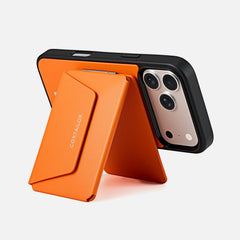 Orange MagSafe Leather Wallet Stand supporting an iPhone in landscape mode